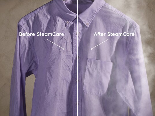 Close-up of purple shirt receiving SteamCare.